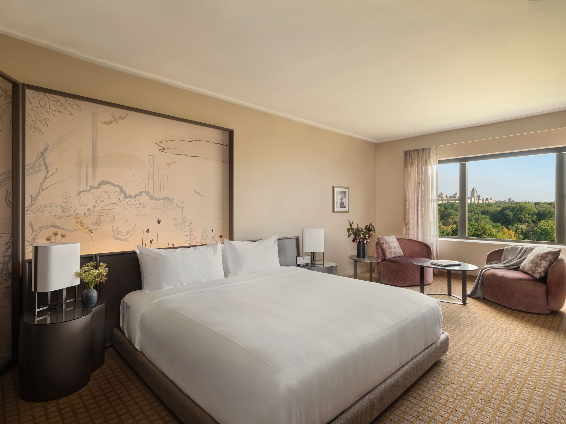 A king suite at Park Lane New York overlooking Central Park.