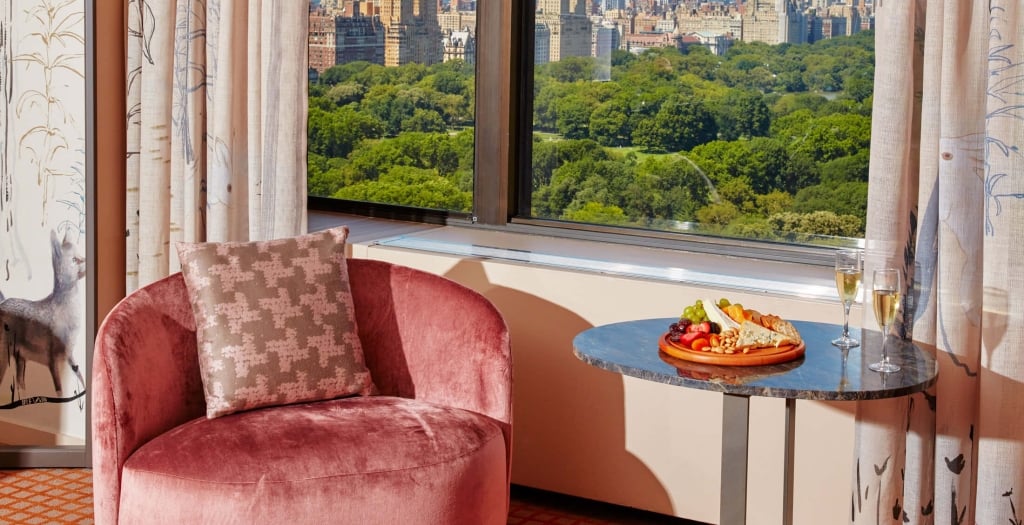 A seating area of a suite overlooking Central Park at Park Lane New York.