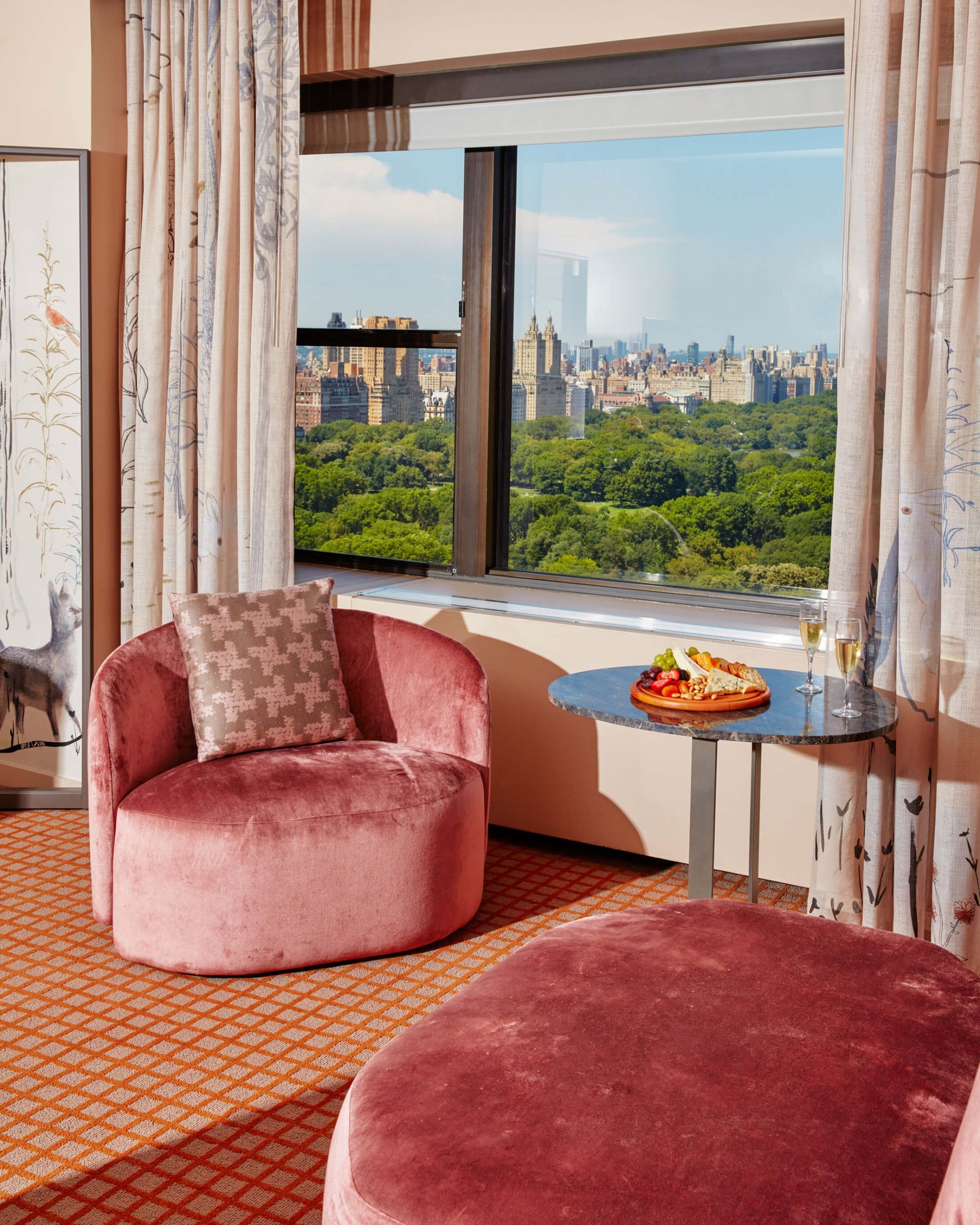 A seating area of a suite overlooking Central Park at Park Lane New York.